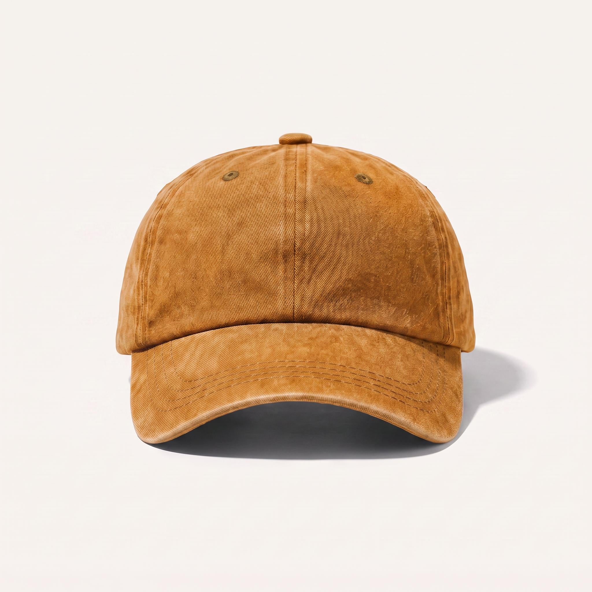 A classic six-panel dad hat in a washed, distressed mustard yellow color, shown from a front-facing angle on a clean off-white background with a soft shadow.