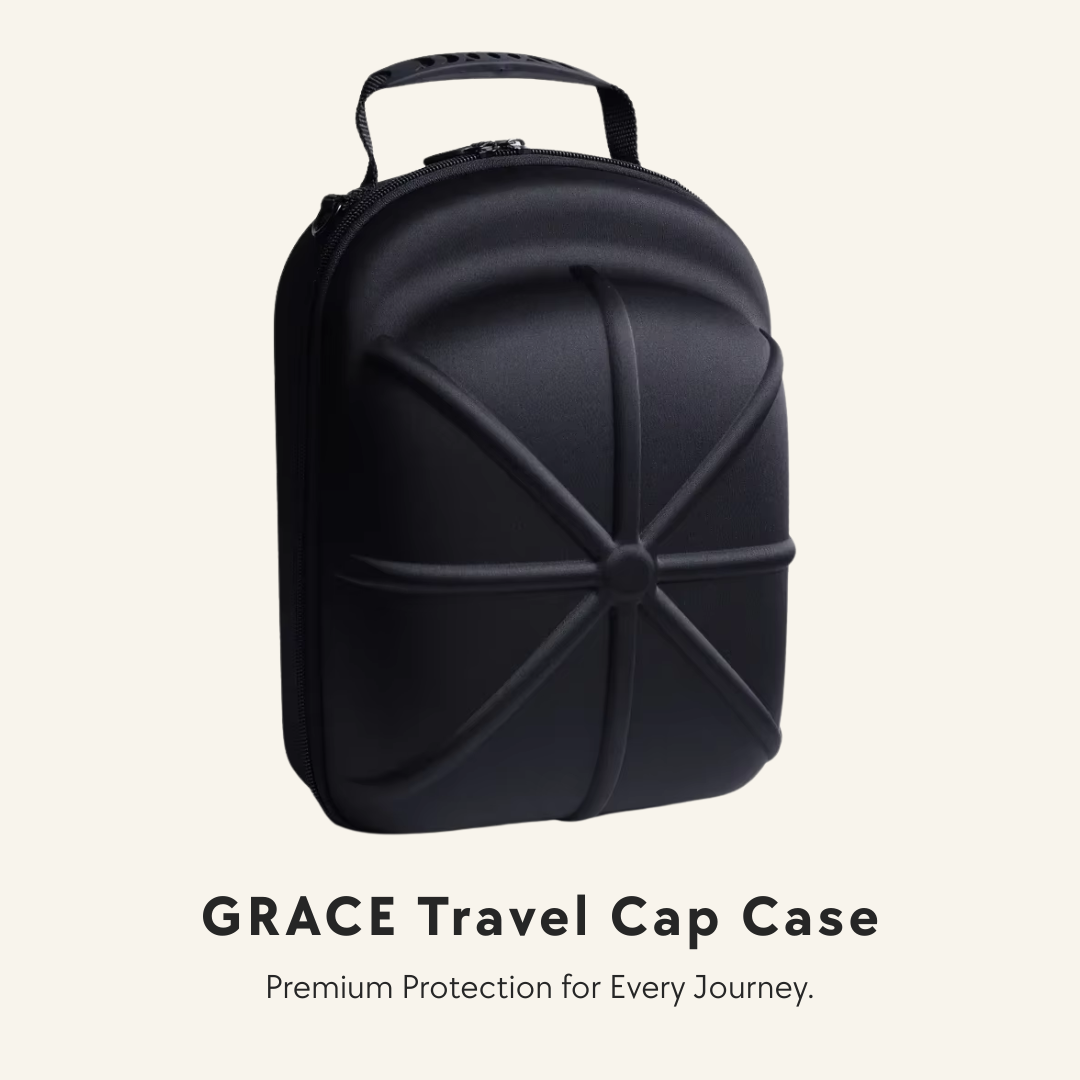 A black hard-shell travel cap case with a top handle, shown on a light beige background with the text 'GRACE Travel Cap Case' and 'Premium Protection for Every Journey.' below it.