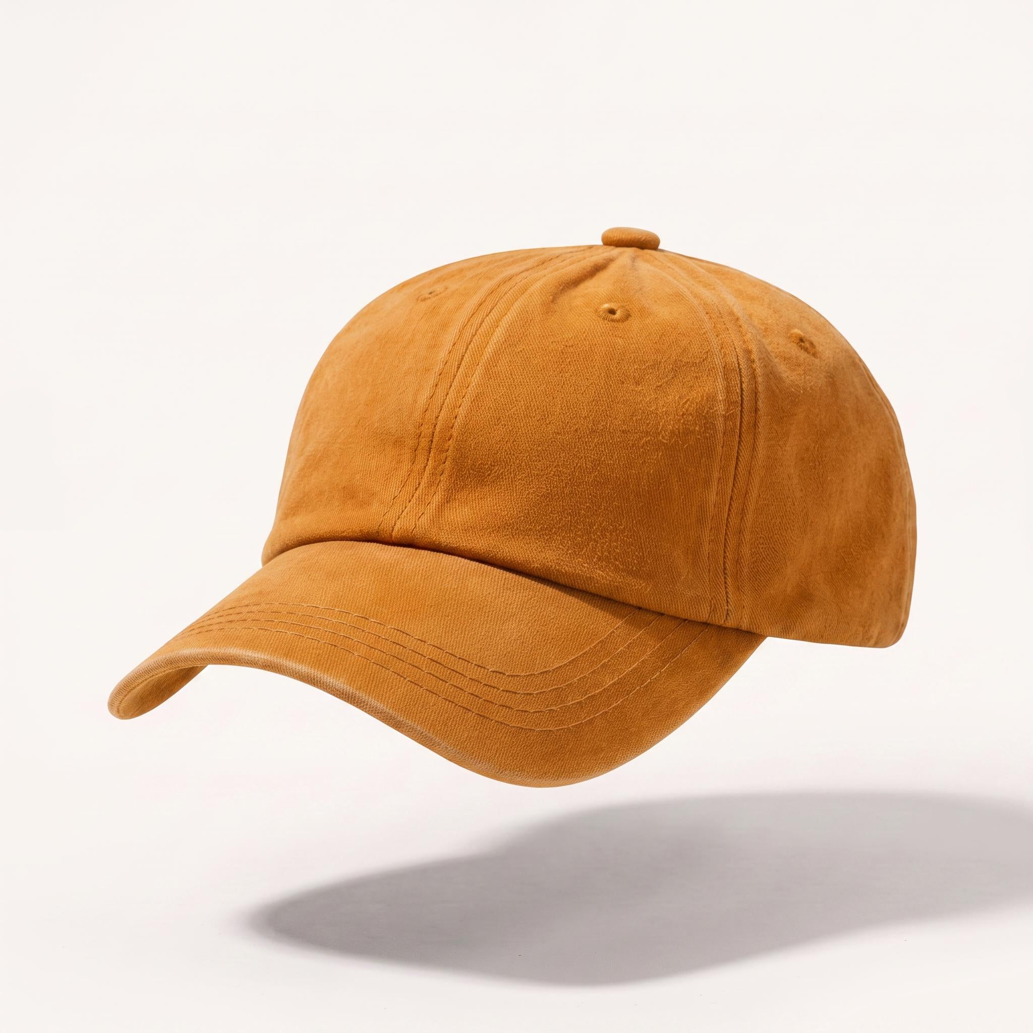 A classic six-panel baseball cap in a warm camel brown color, shown floating against a clean white background with a soft shadow underneath.