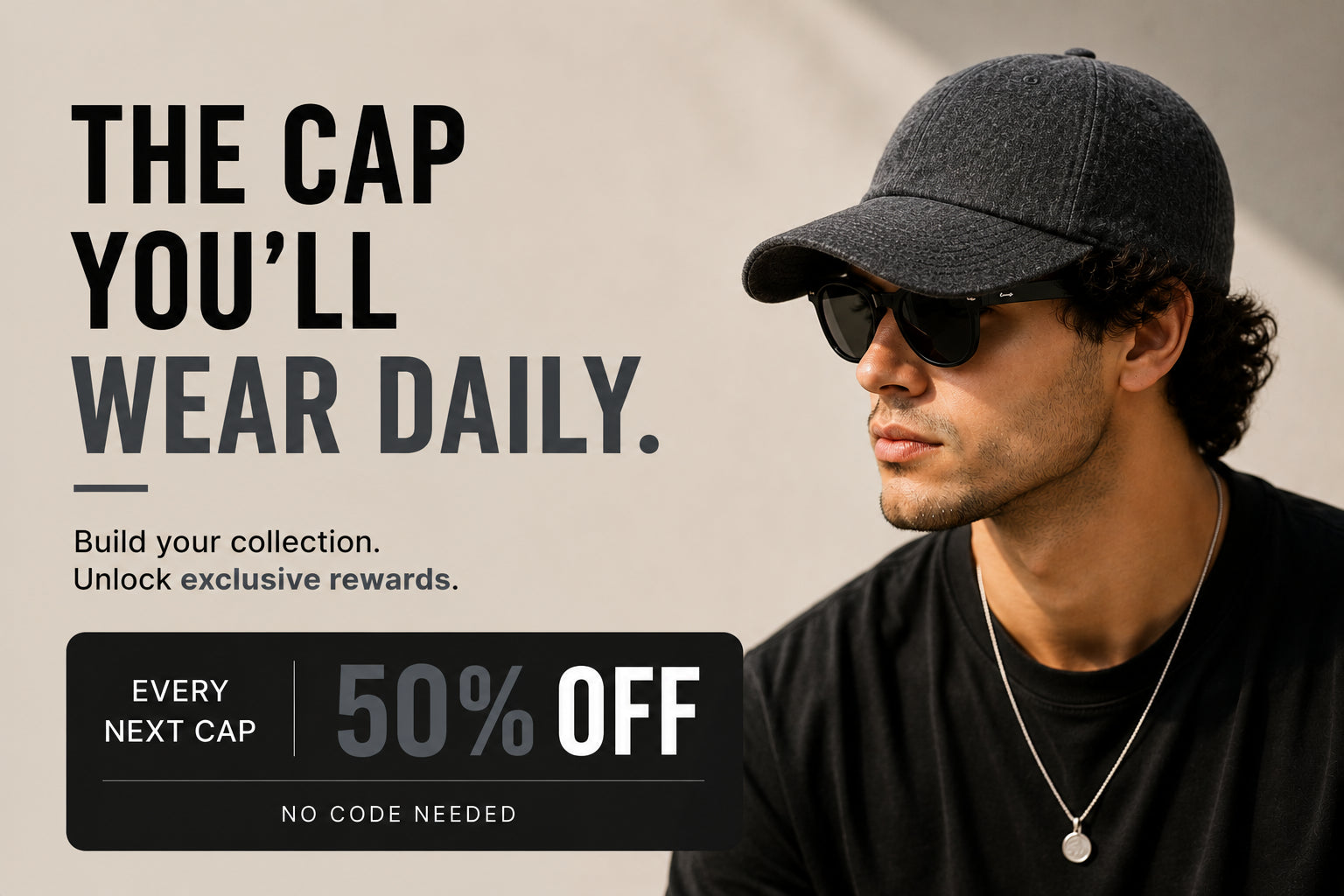 A promotional graphic featuring a man in profile wearing a dark gray textured baseball cap, black sunglasses, and a black shirt. Large text on the left reads 'THE CAP YOU’LL WEAR DAILY.