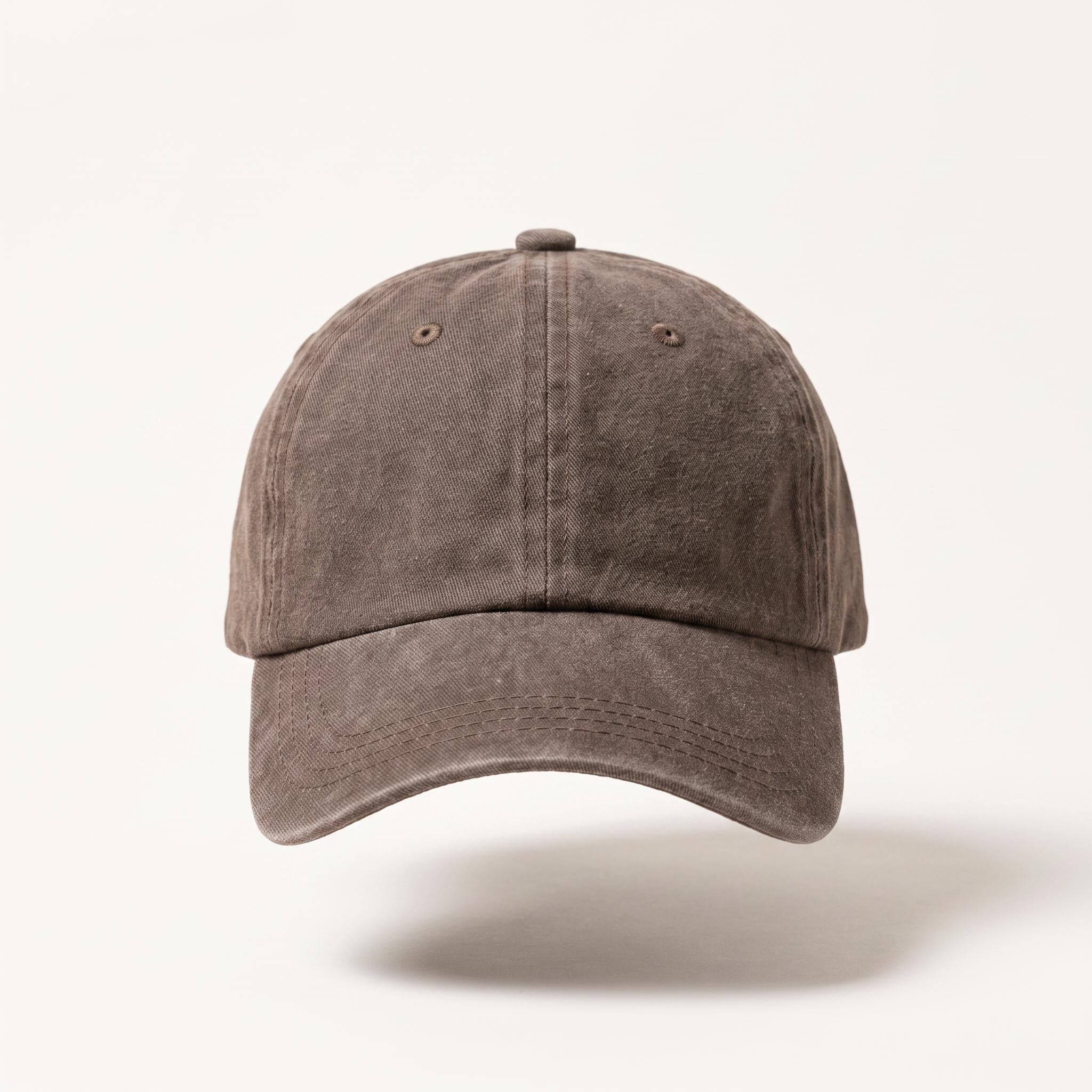 A washed, distressed baseball cap in a muted taupe-brown color, shown from a front-facing perspective against a clean, light off-white background.
