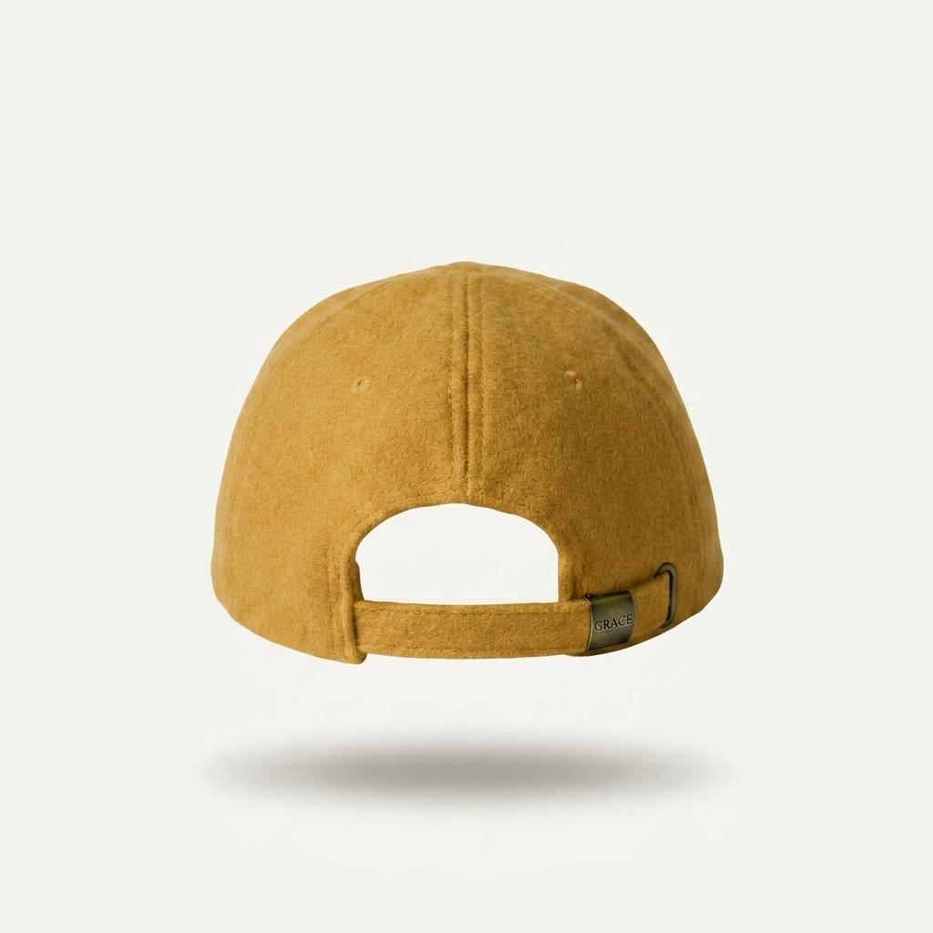 A mustard yellow felt baseball cap shown from the back, floating against a clean off-white background with a soft drop shadow.