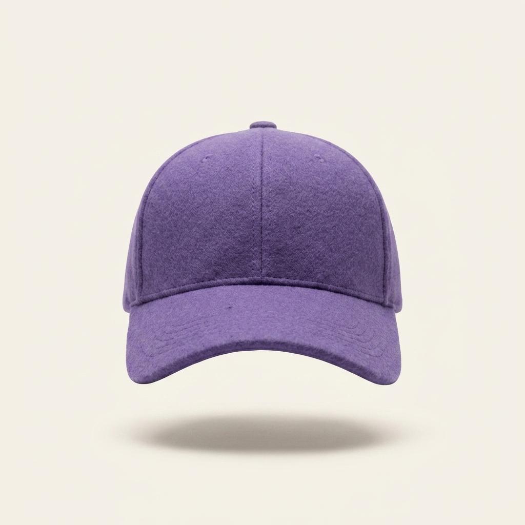 A solid purple baseball cap made of a textured, heathered fabric, shown from the front on a light cream background with a soft drop shadow.